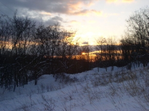 Zimní podvečer - Slunce zapadající do sněhu